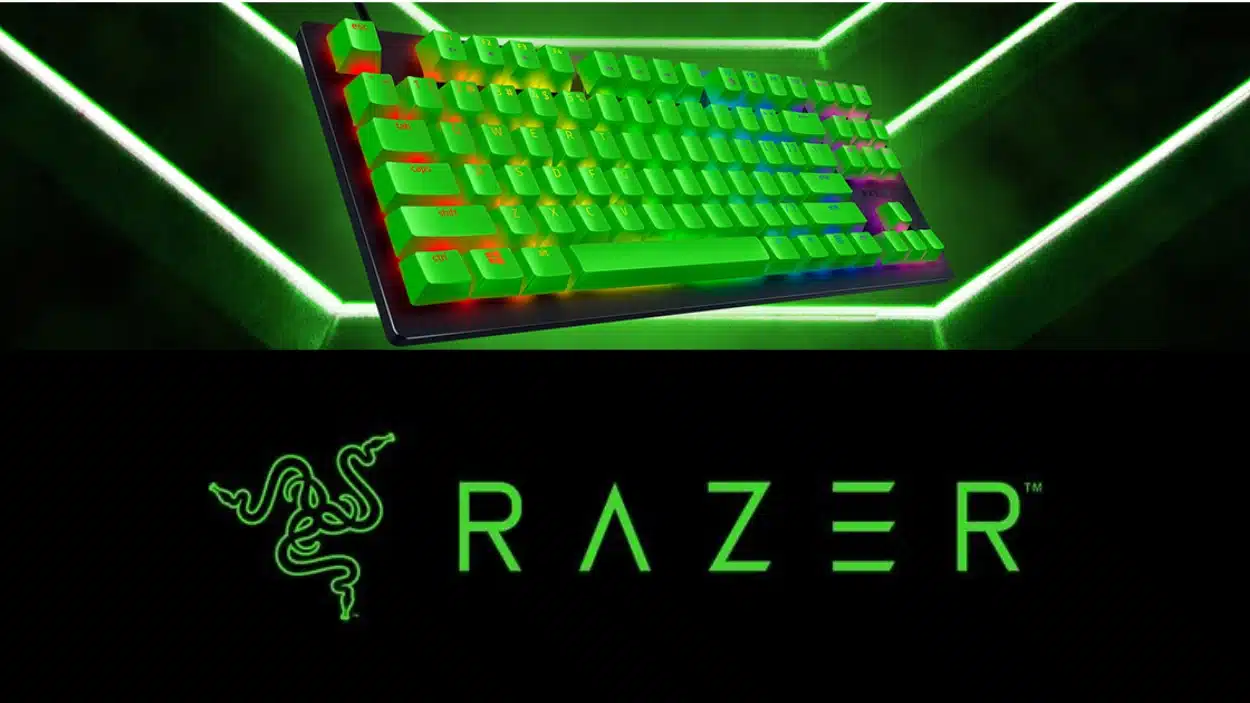 A Razer mechanical keyboard with bright green backlighting is displayed above the neon green Razer logo on a black background