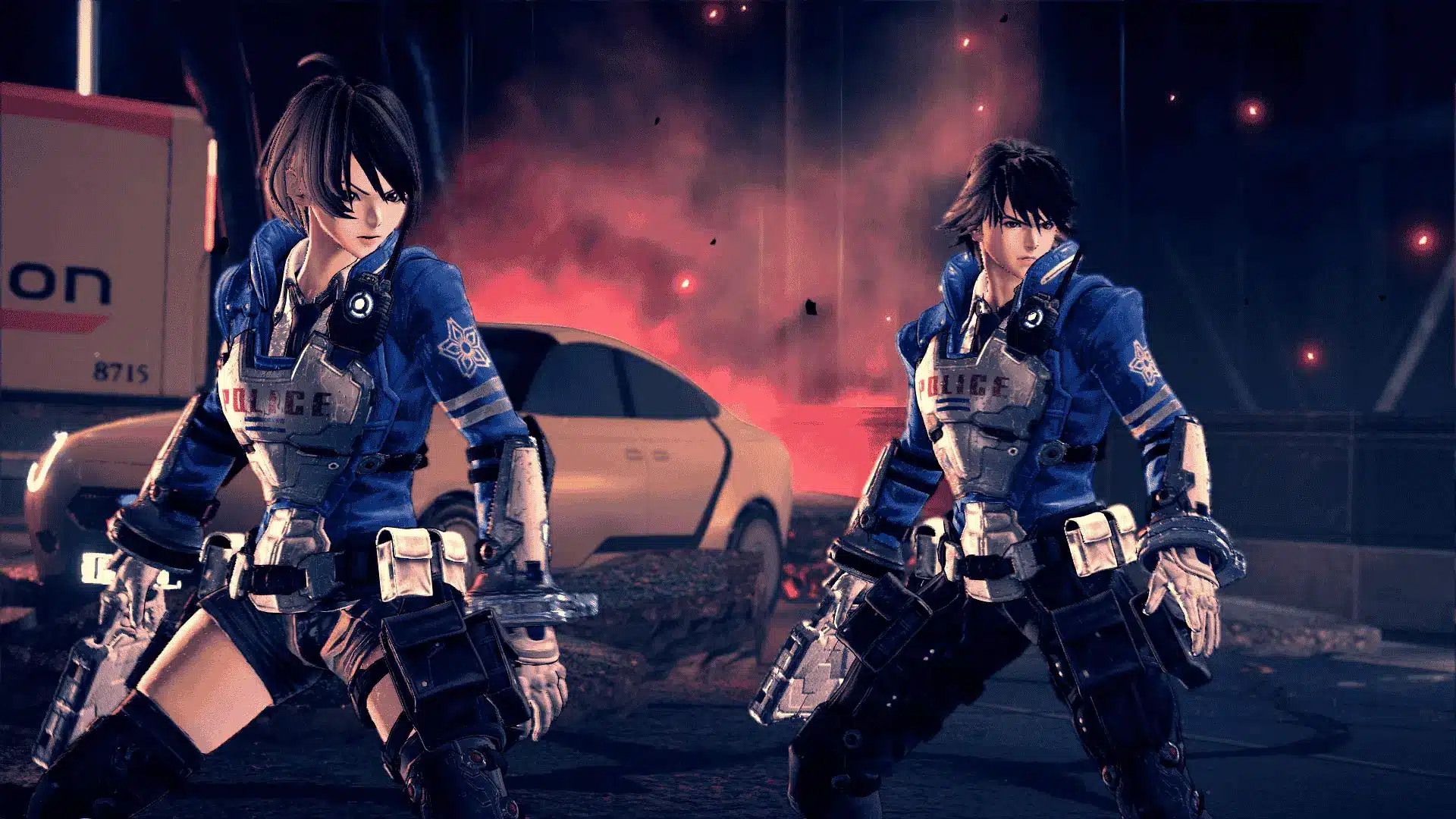 Astral Chain's male and female twin protagonists stand in combat poses on a street with smoke and fire behind them.
