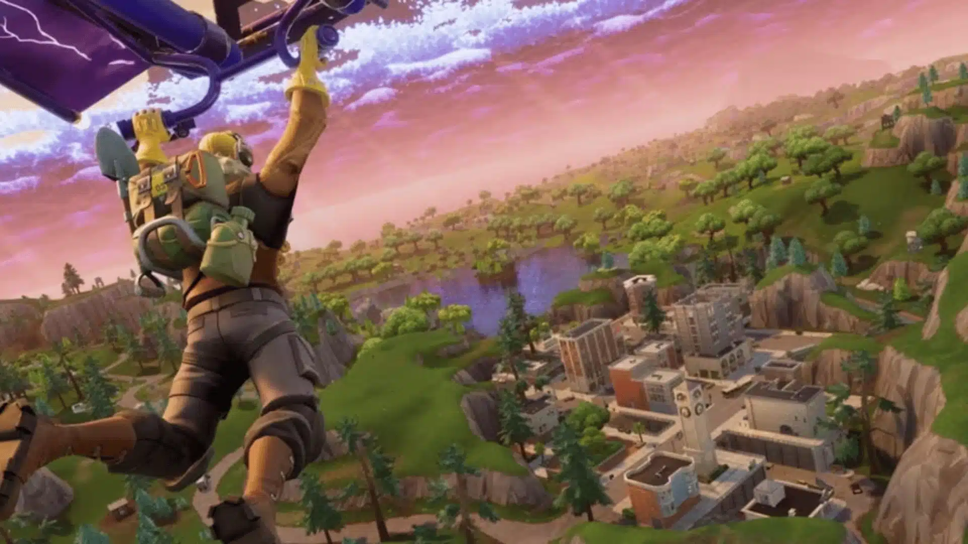 Fortnite player gliding over the island while choosing a landing location for a match.
