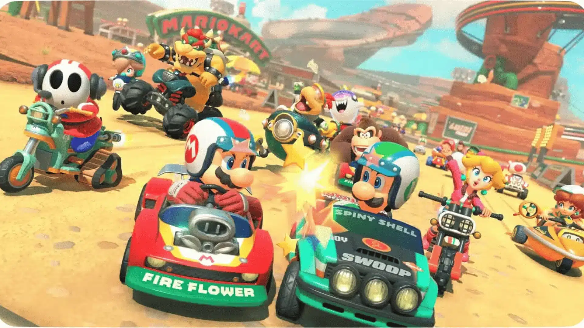 Mario Kart characters racing on a desert track with items and karts colliding mid-race.