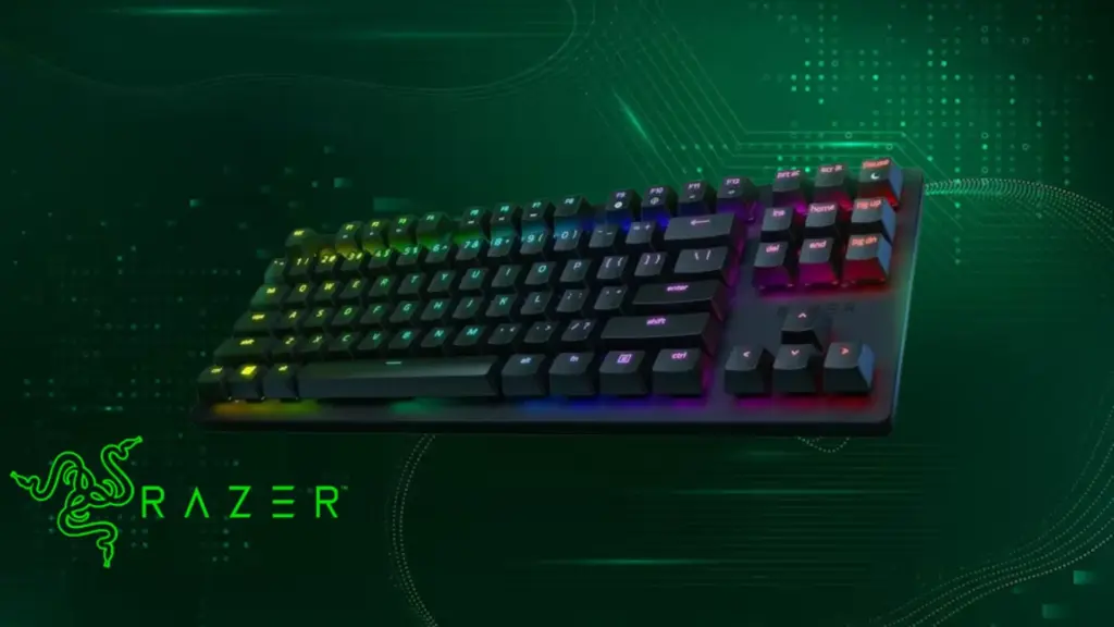 RGB gaming keyboard with green lighting and Razer logo on dark background