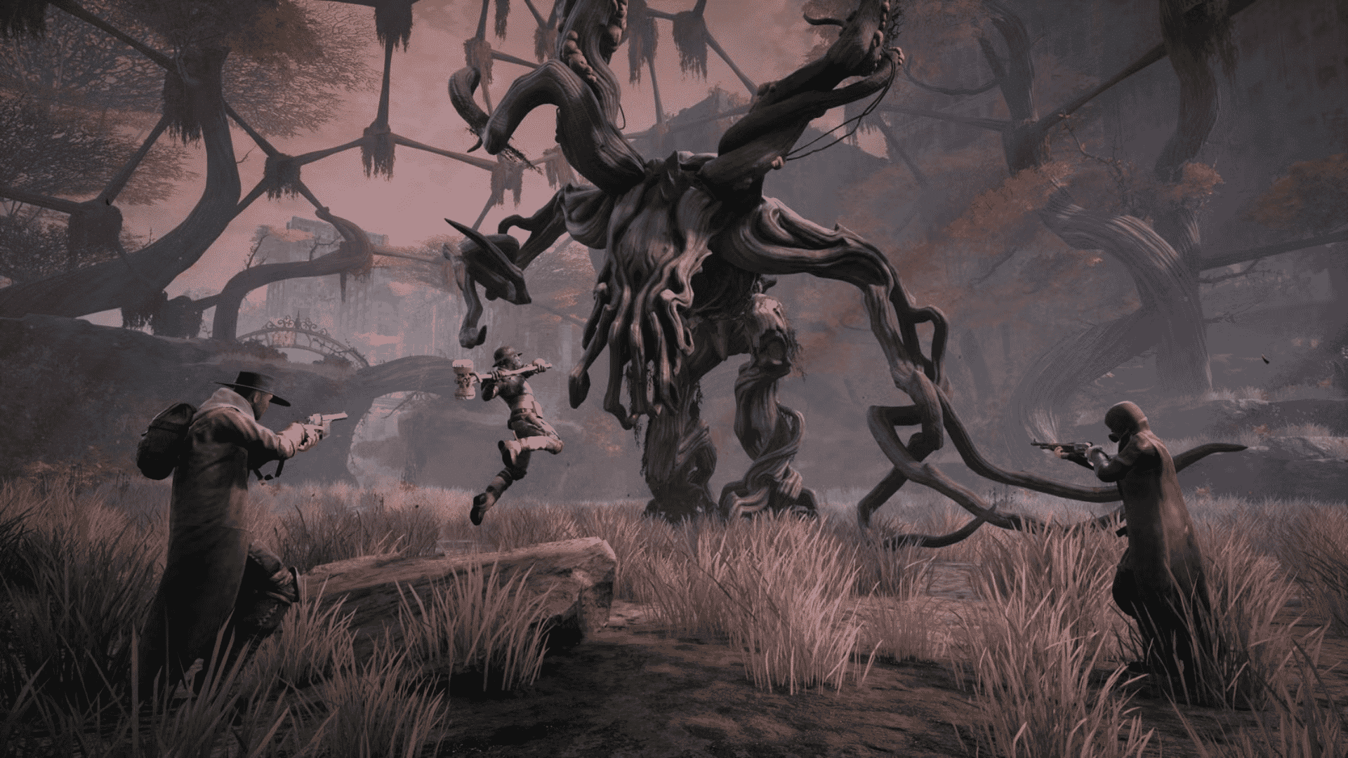 Three players battle a massive, multi-limbed root monster in a desolate, overgrown field from Remnant: From the Ashes.