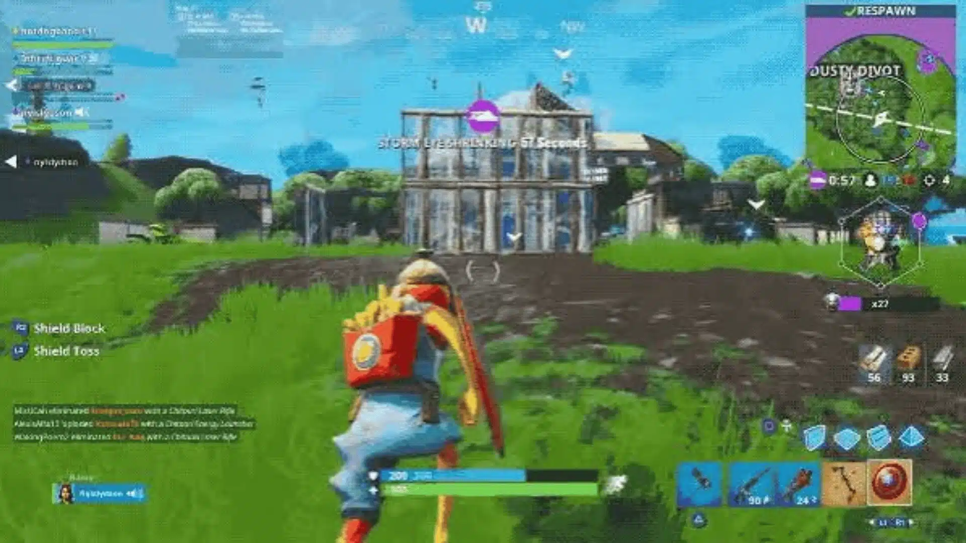 Fortnite gameplay showing a player building structures and fighting opponents in an open area.