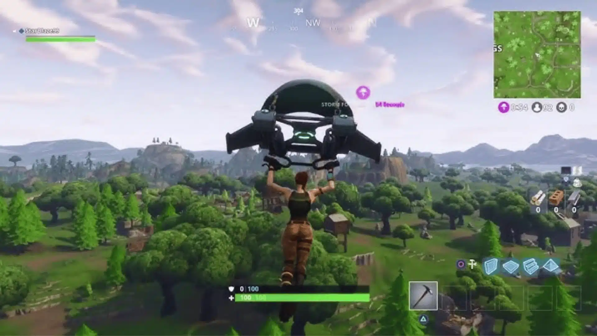Fortnite player gliding over the island while choosing a landing spot before a match.
