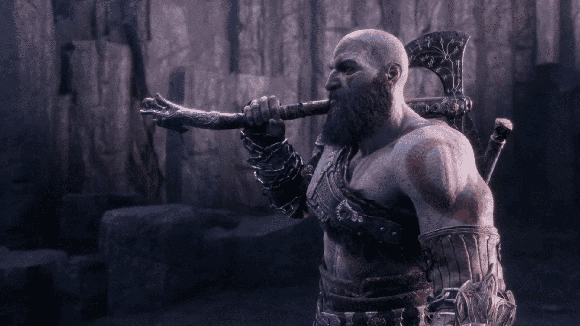 Kratos from God of War holding the Leviathan Axe over his shoulder in a dark, rocky setting.