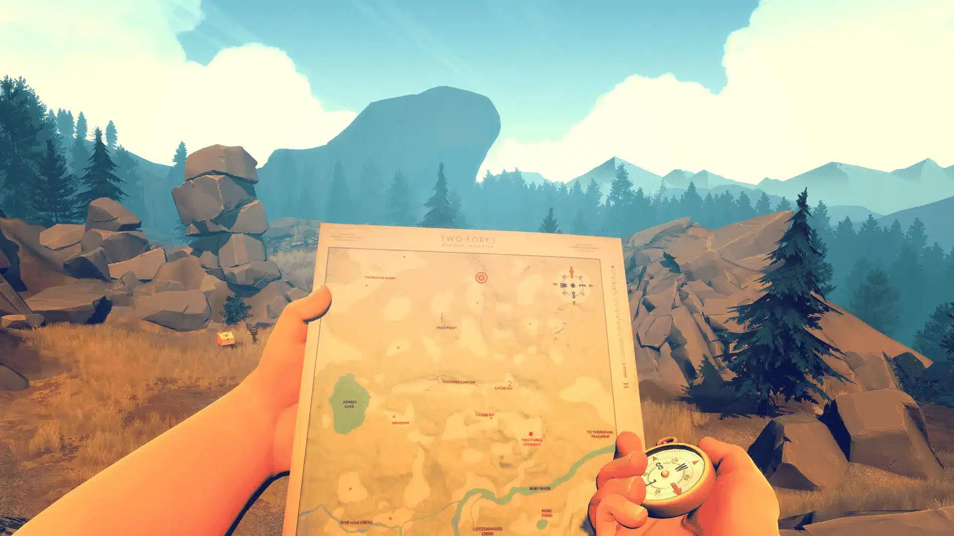 Henry holding a map and compass in Firewatch's Wyoming wilderness — exploring the narrative mystery at the heart of the game.