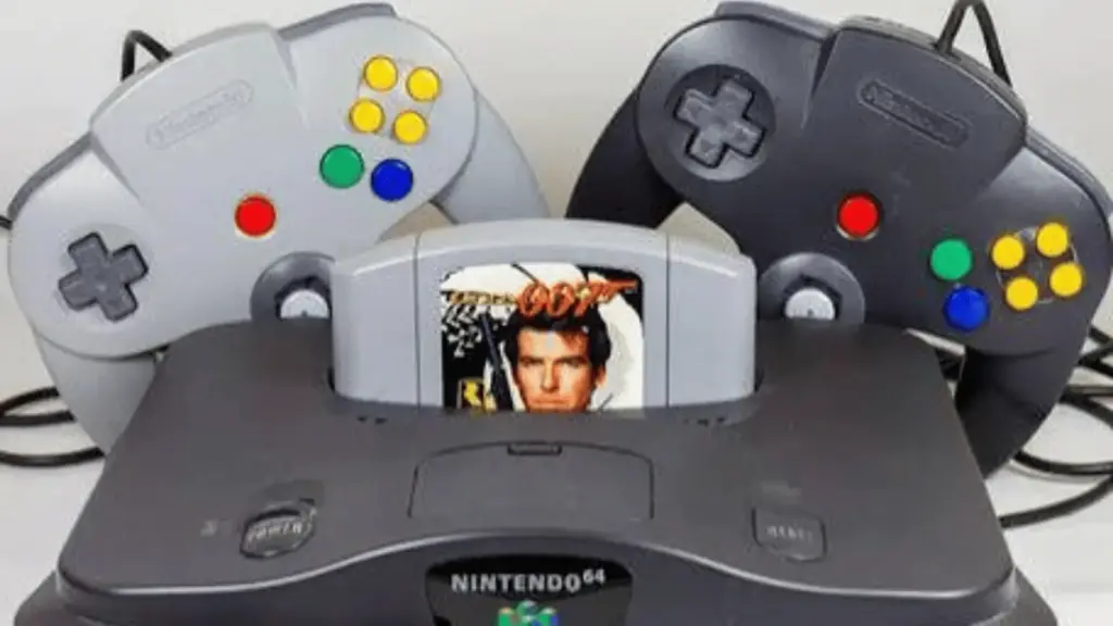 Nintendo 64 console with three controllers arranged behind it and a GoldenEye 007 cartridge inserted in the center