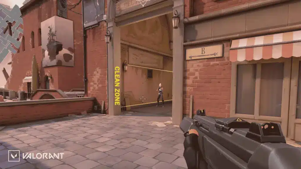 Valorant Ascent gameplay scene showing a player aiming at an enemy near B site entrance.