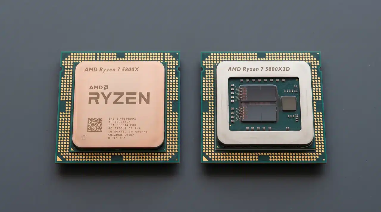 Two AMD AM4 CPUs on a dark matte surface, one with visible stacked cache die on heatspreader