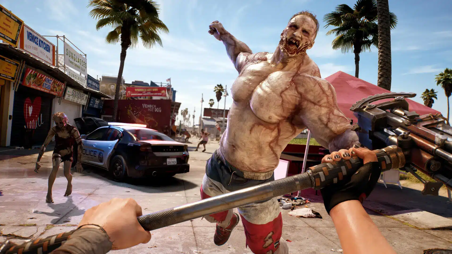 Dead Island 2 zombie attacking a player on a Venice Beach street with a weapon in hand