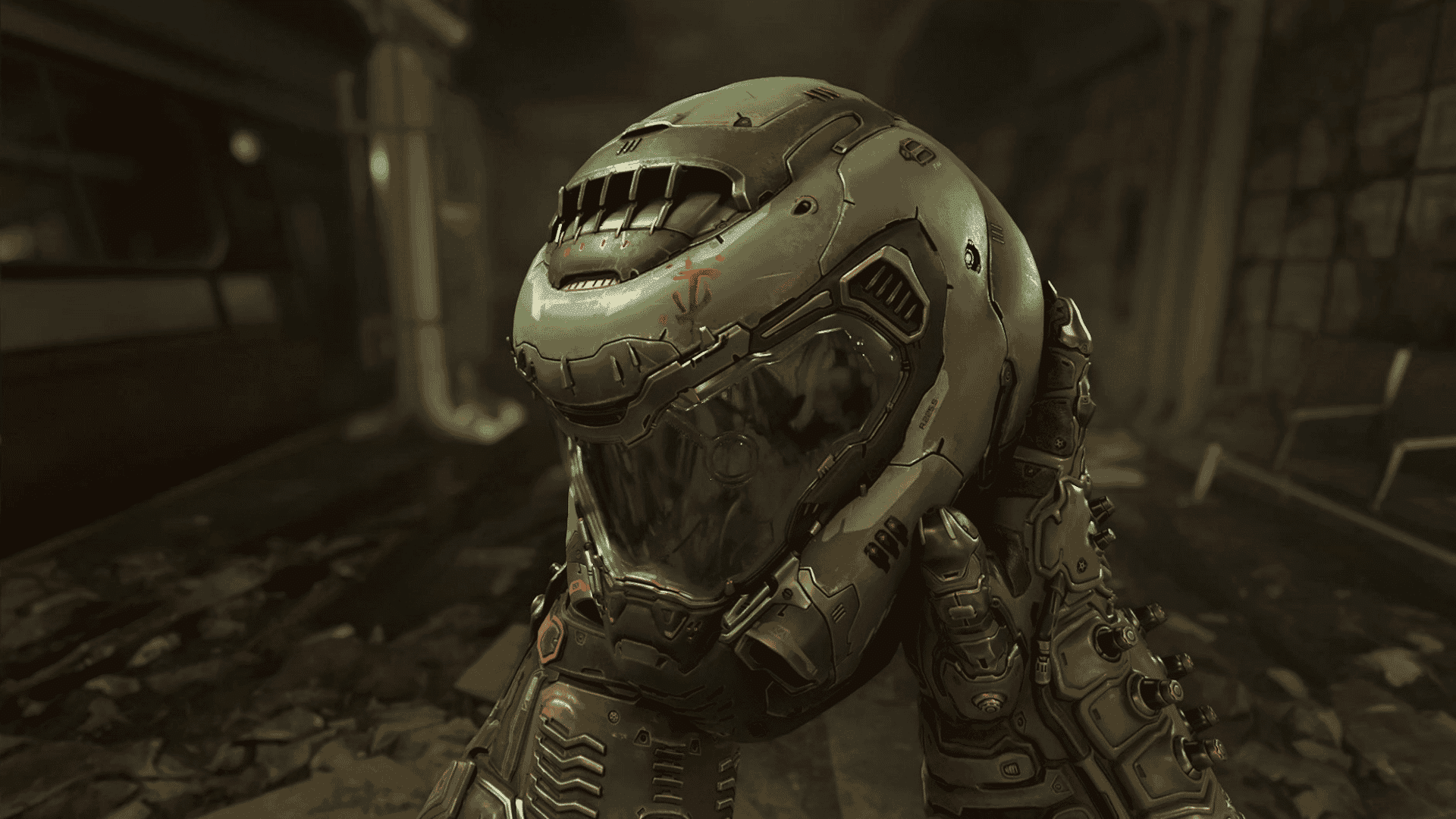 A first-person view of armored, gloved hands holding up a futuristic green space marine helmet.