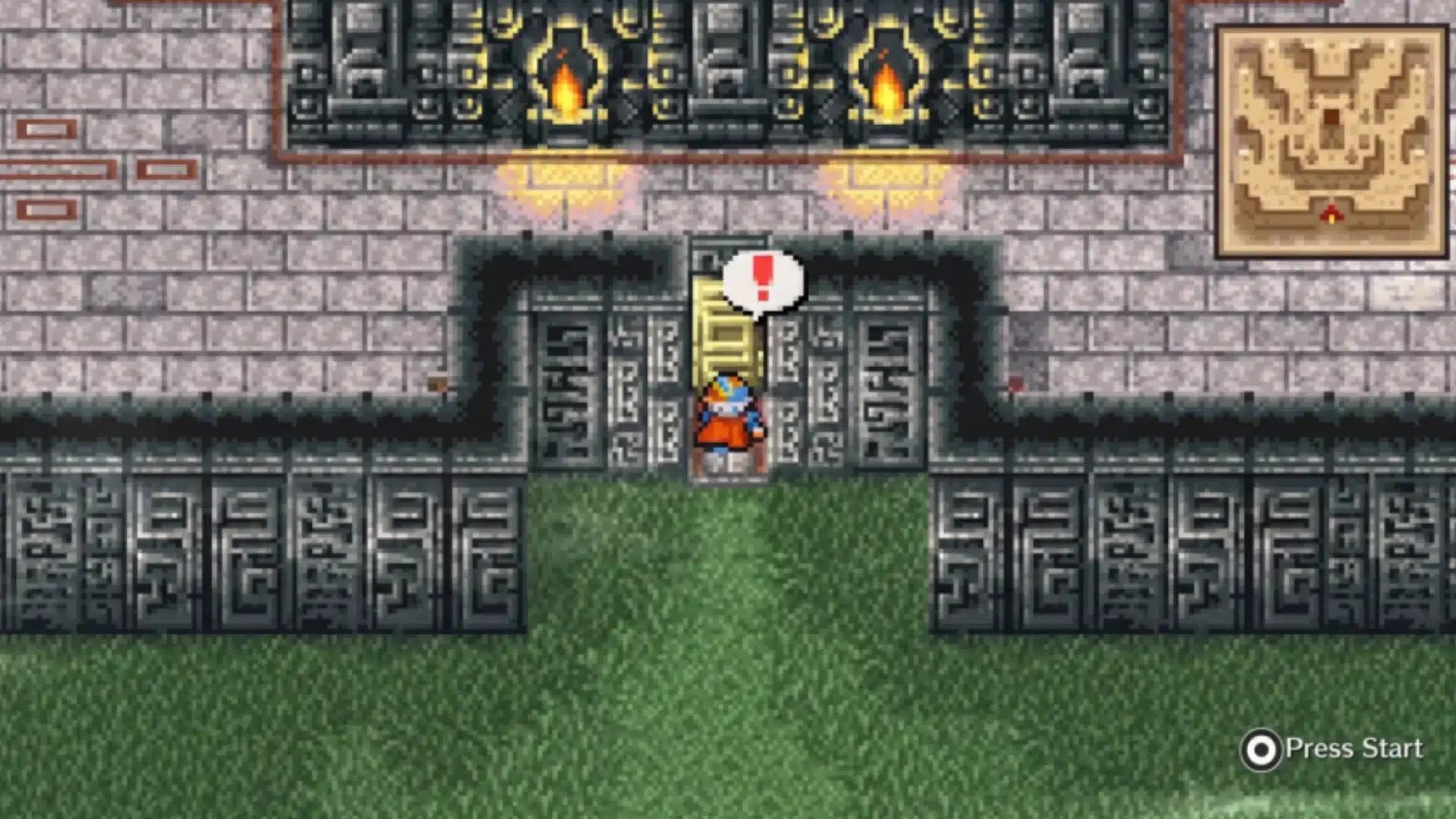 Final Fantasy II character stands at a guarded stone gate inside a torch-lit fortress