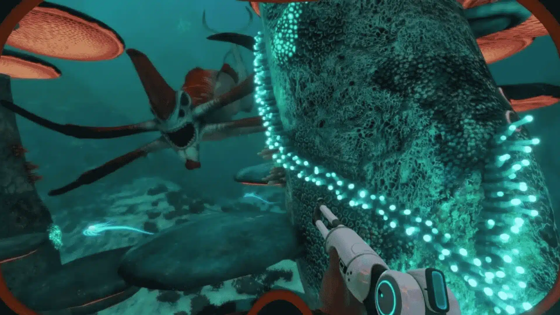 First-person view from Subnautica showing a Reaper Leviathan swimming near a large coral structure.