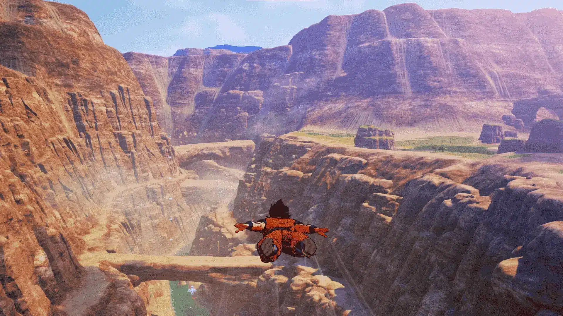 Goku flying through a rocky canyon in Dragon Ball Z: Kakarot’s open world.