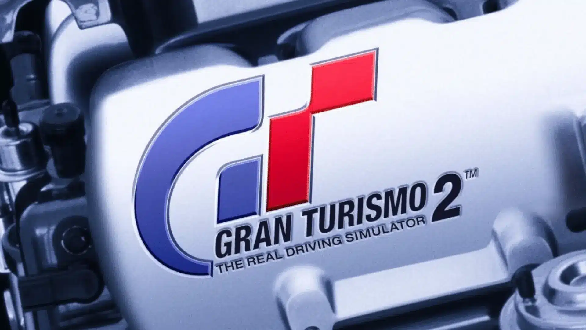 Gran Turismo 2 logo displayed on a close-up view of a car engine, highlighting the racing simulator theme.