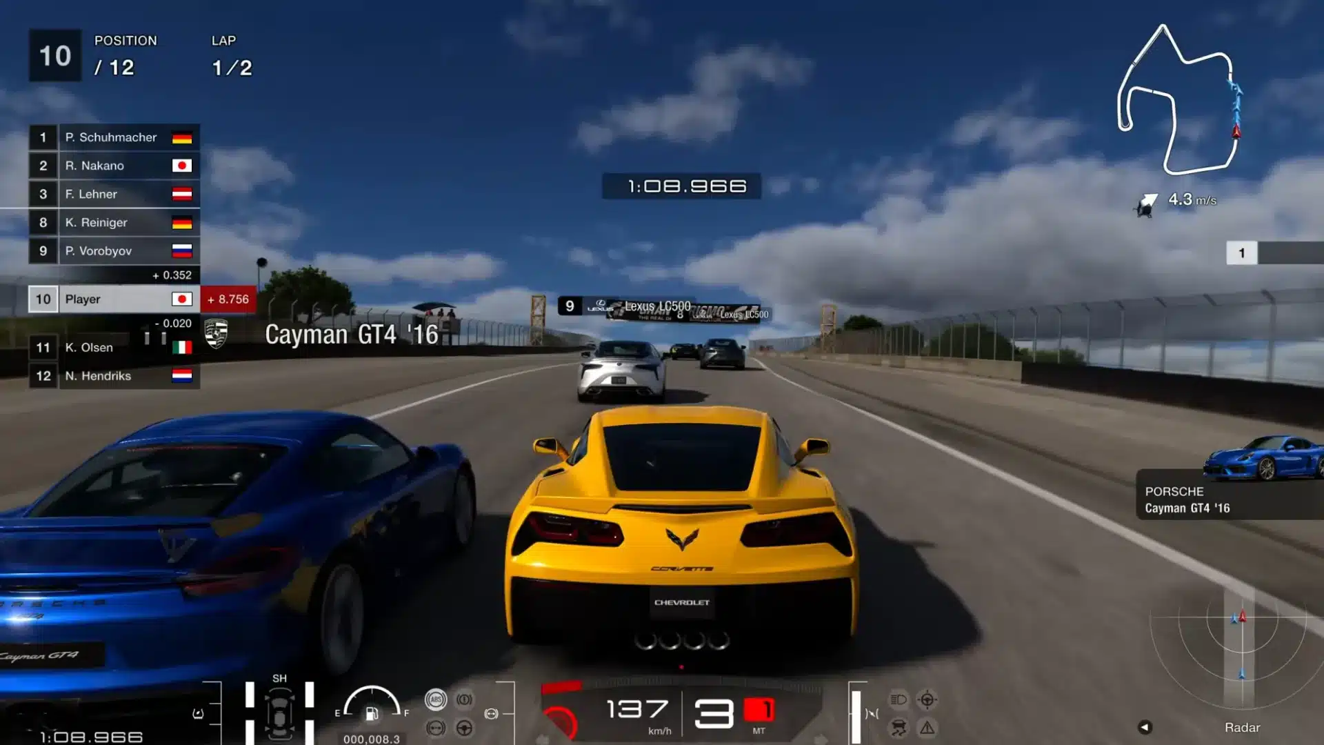 Yellow sports car races beside a blue rival on a crowded Gran Turismo race circuit