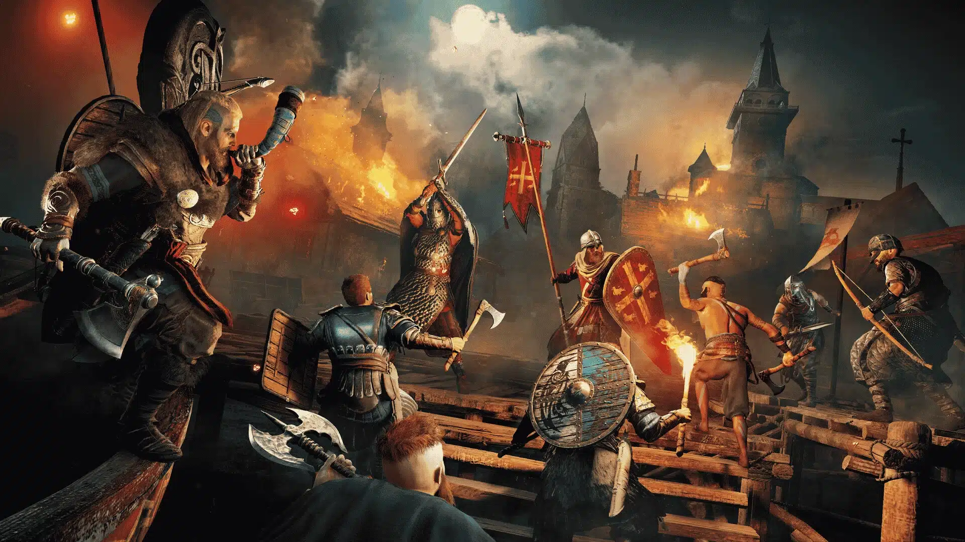 Vikings clash with defending soldiers on a wooden dock before a burning medieval castle under a stormy night sky.