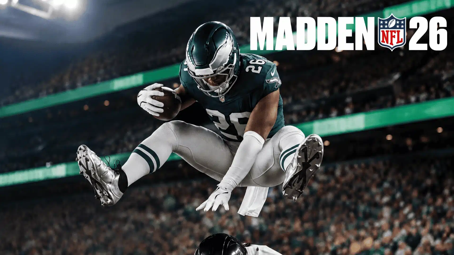 Football player leaping over a defender on a stadium field, Madden NFL 26 title text in upper right corner