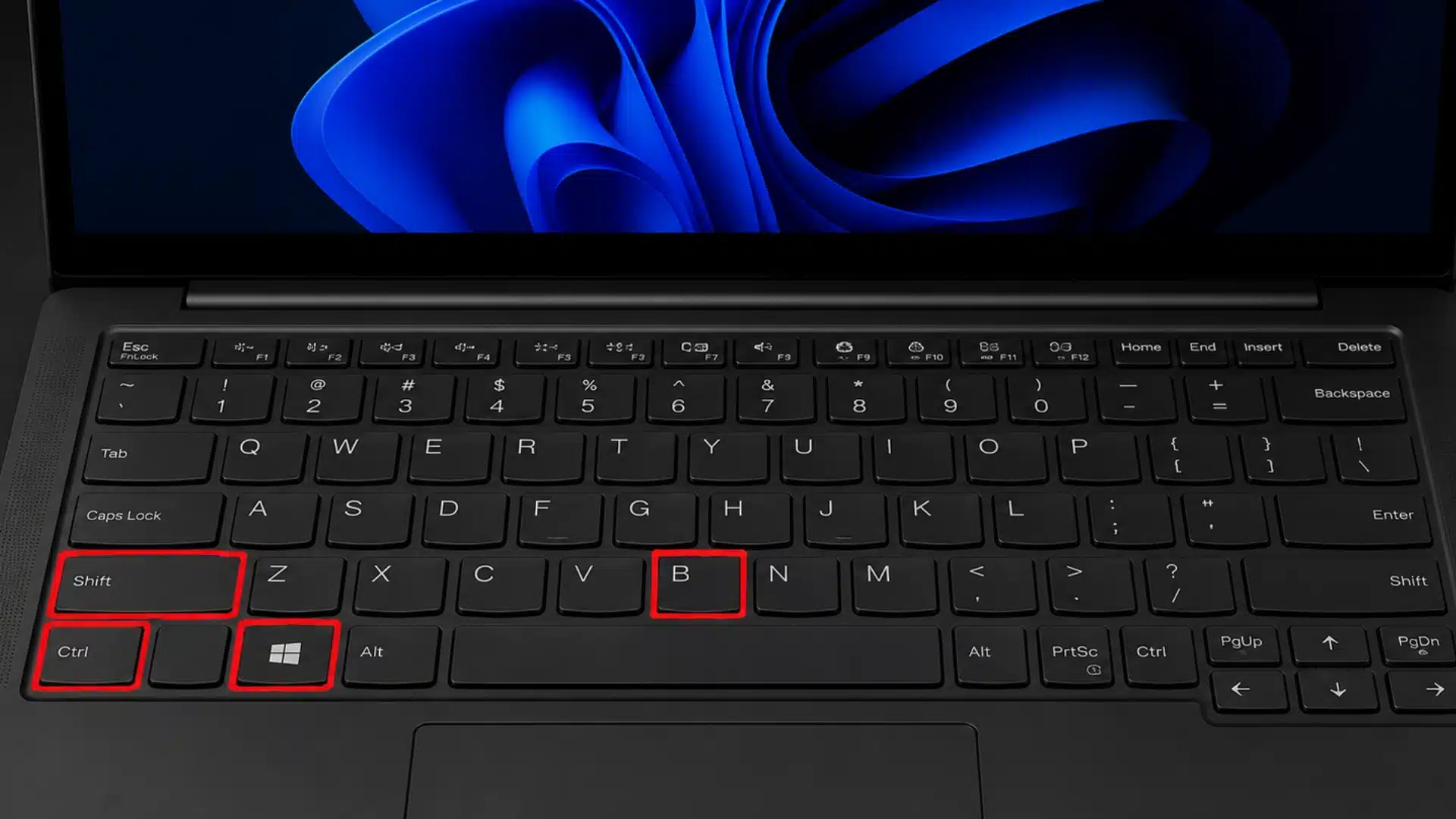 Laptop keyboard highlighting Ctrl, Shift, Windows, and B keys for graphics reset