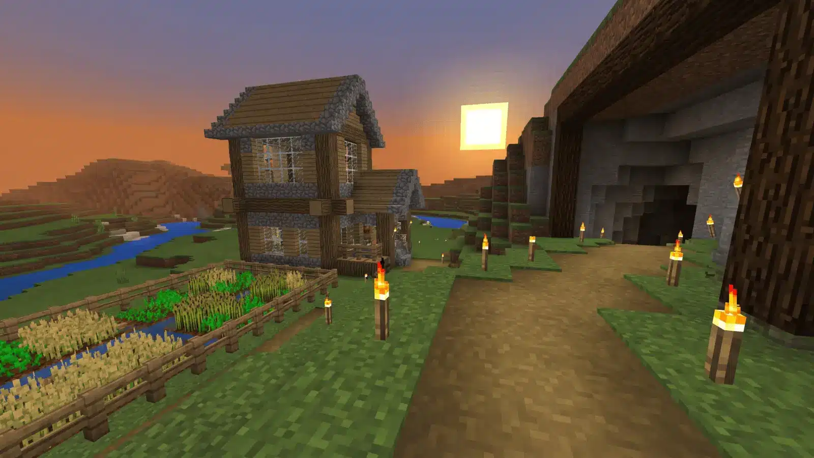 Block-built farm and house beside a cave entrance