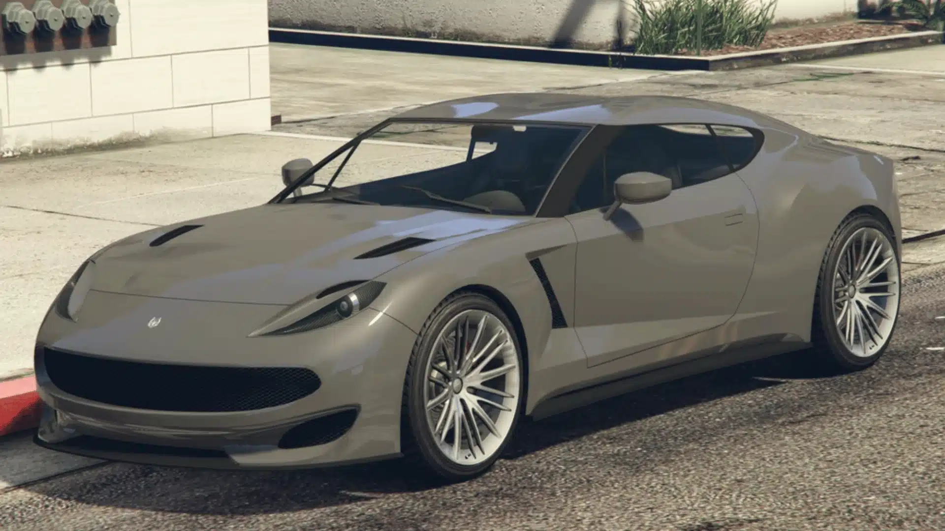 Gray Ocelot Pariah parked beside a curb on a sunny street in GTA Online