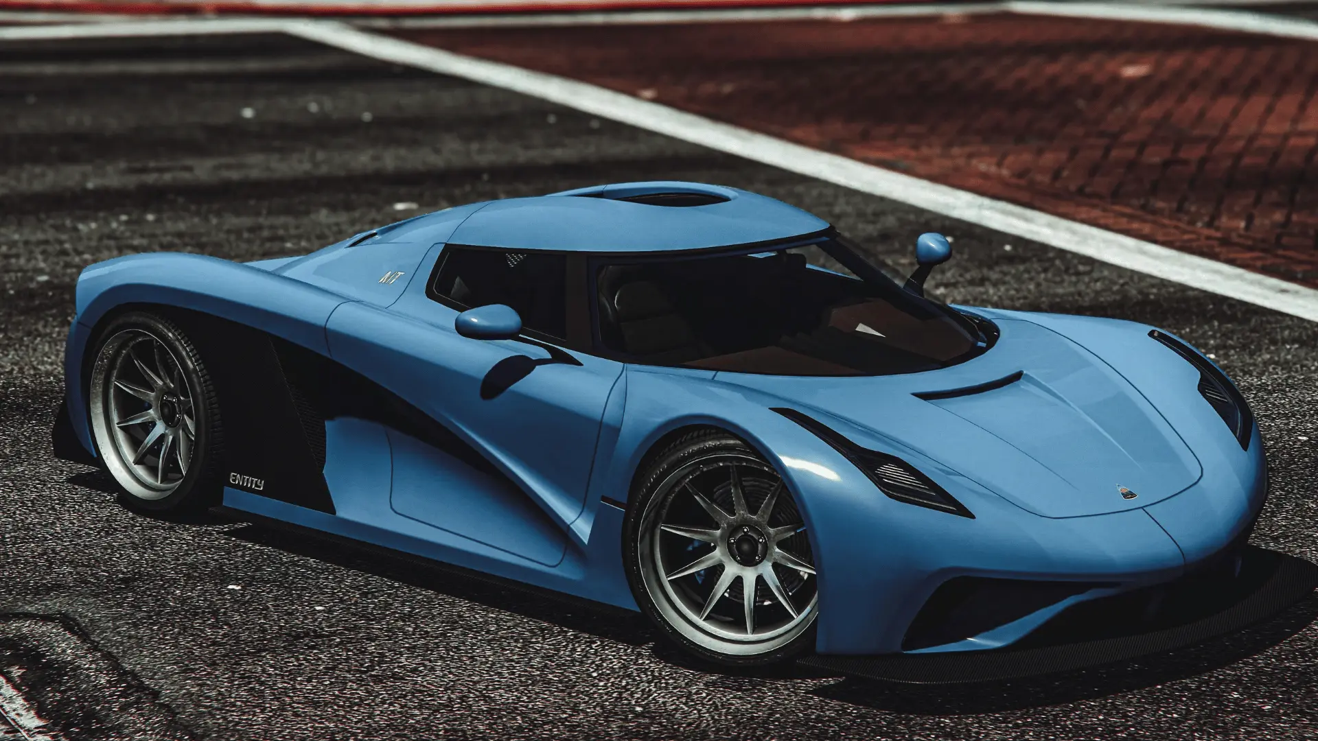 Blue Overflod Entity MT with black side panels parked on a marked road in GTA Online