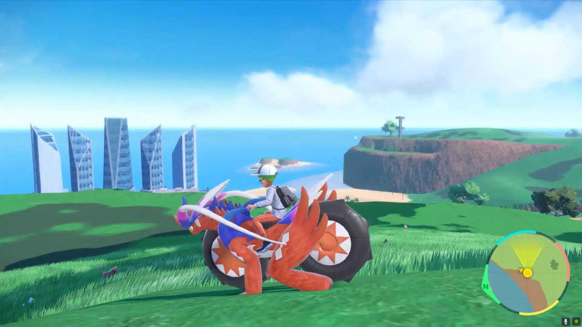 Player character riding the legendary creature Koraidon across an open grassy landscape in Pokémon