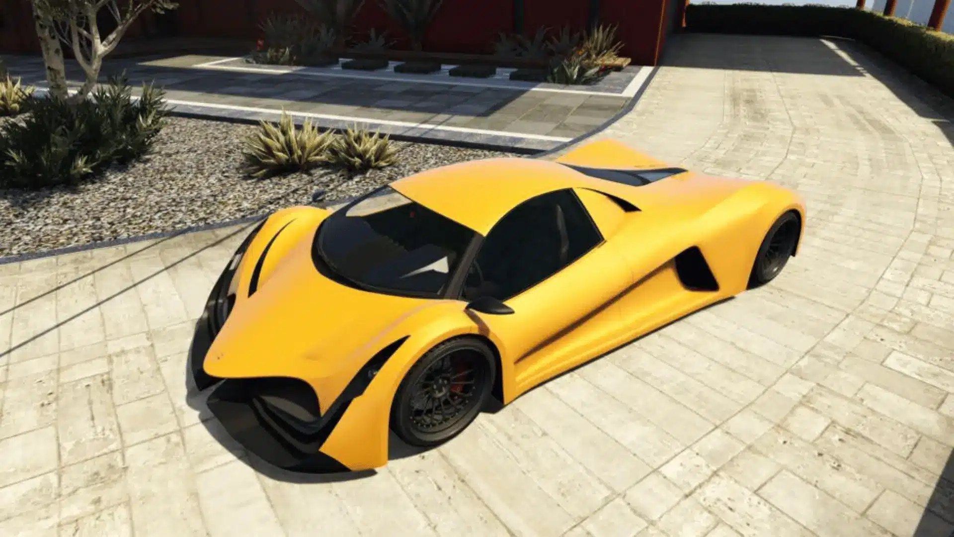 Orange Principe Deveste Eight parked on a modern driveway in GTA Online
