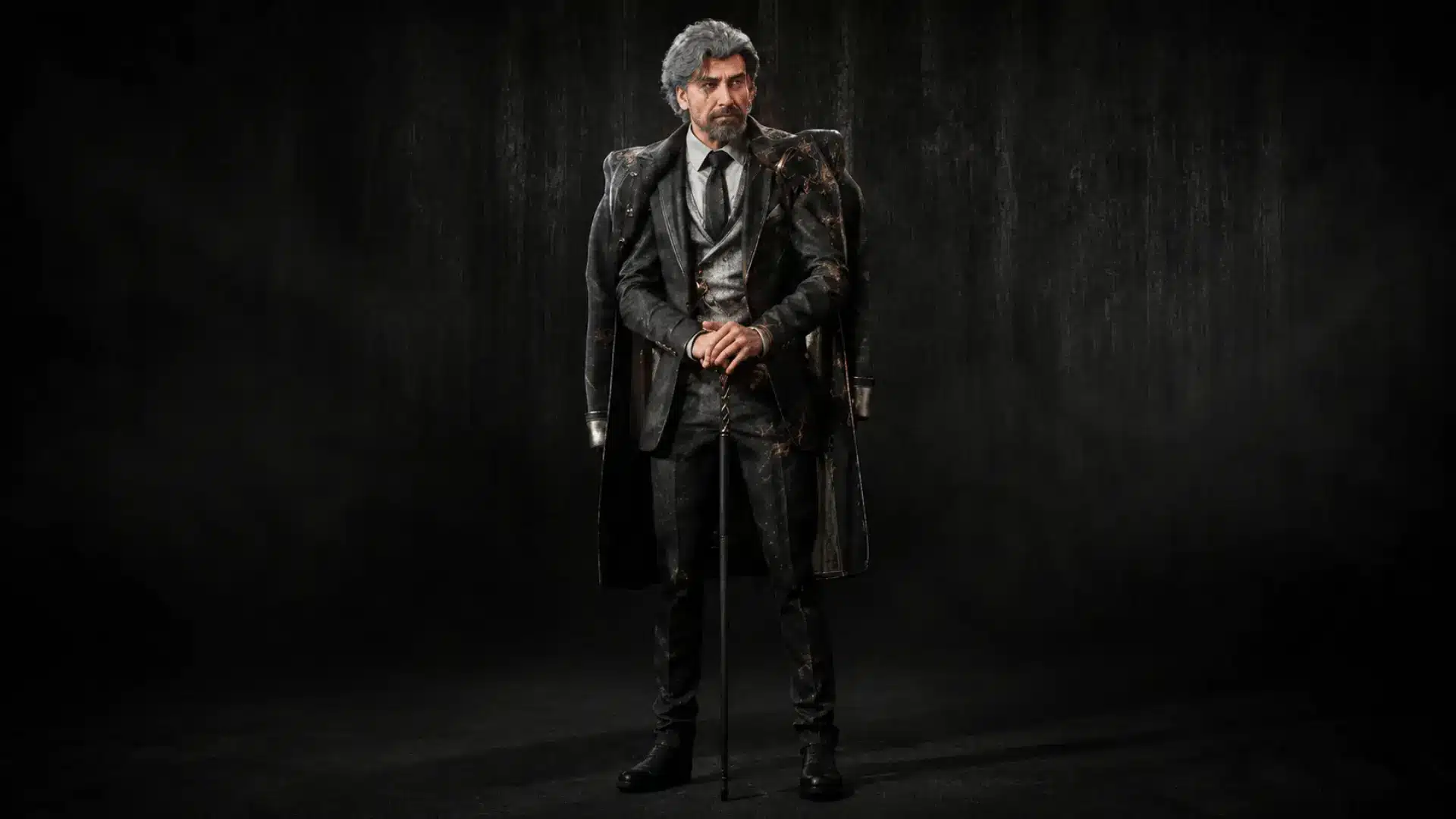 Renoir in a black suit and long coat standing with a cane against a dark background.