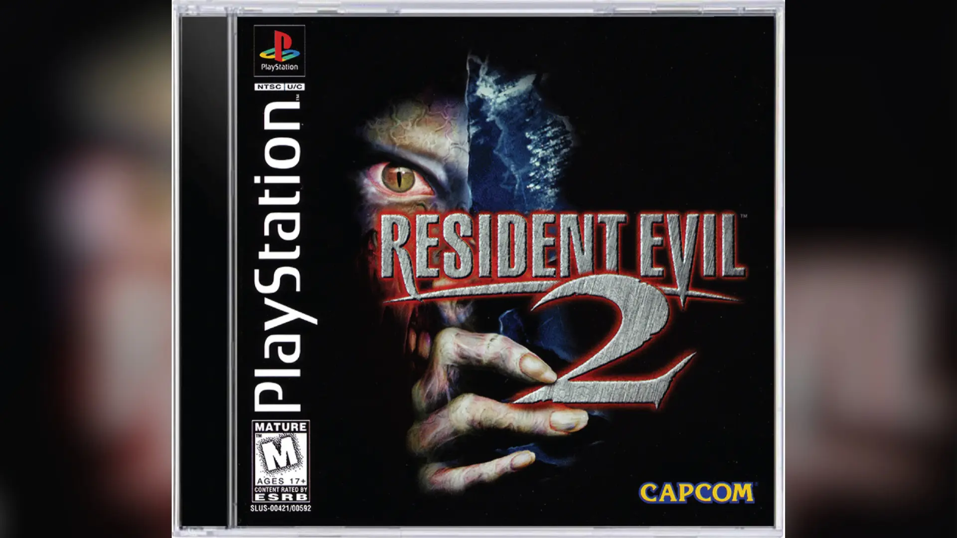 Resident Evil 2 original PlayStation 1 video game cover art featuring a zombie eye and hand.