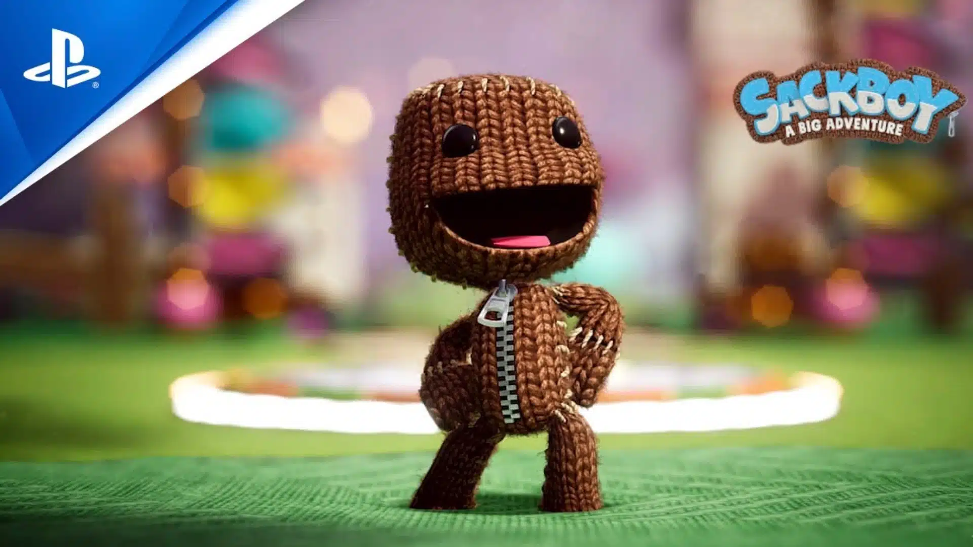 Sackboy smiles on a colorful platform in Sackboy A Big Adventure for PlayStation