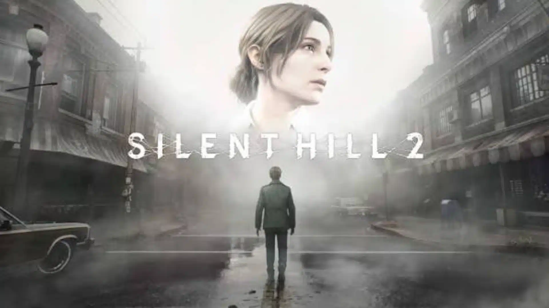 Silent Hill 2 cover showing a man walking through a foggy deserted street with a woman’s face above the city skyline.