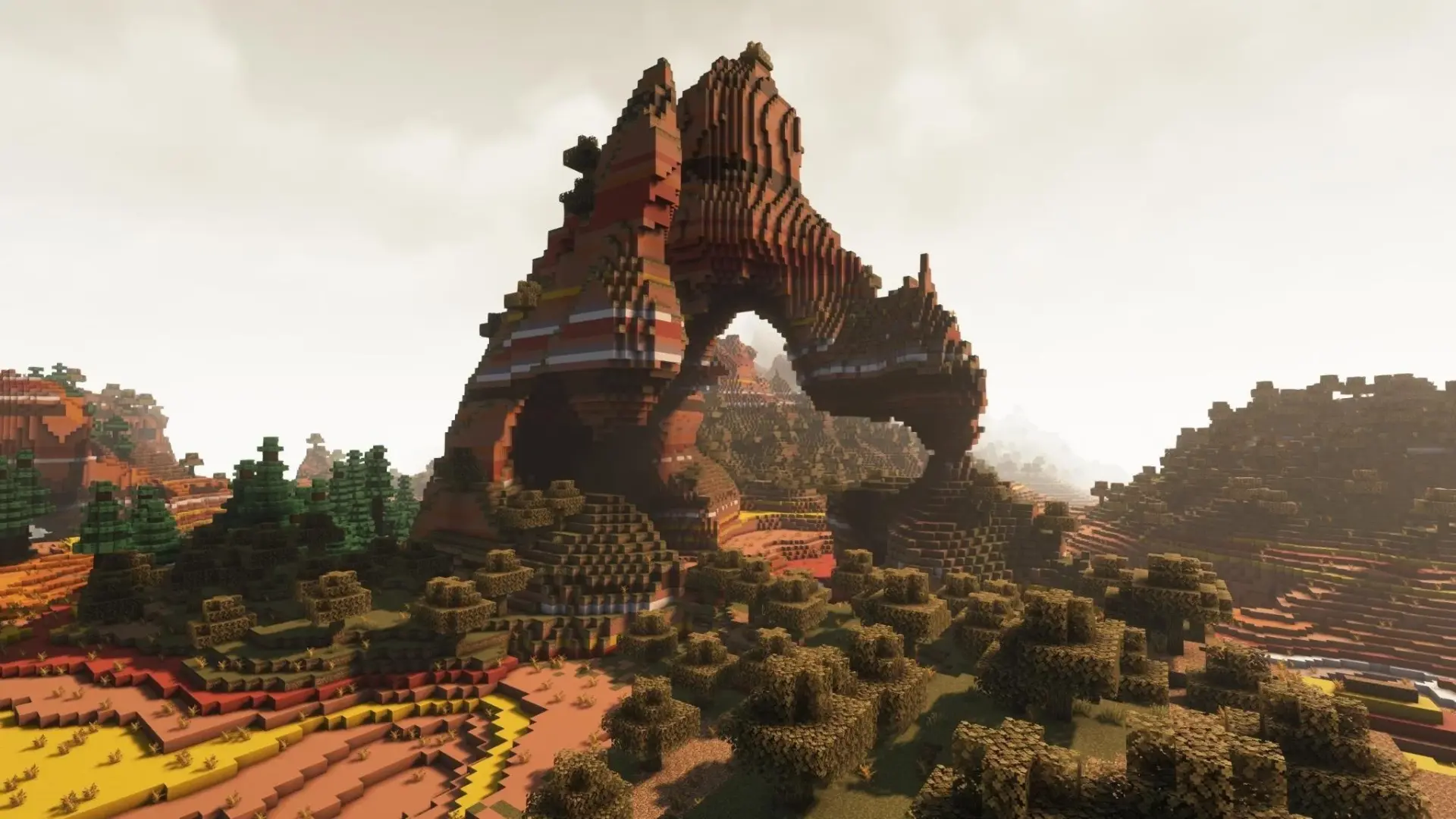 Minecraft landscape with expanded terrain generation featuring large rock formations and improved biomes.