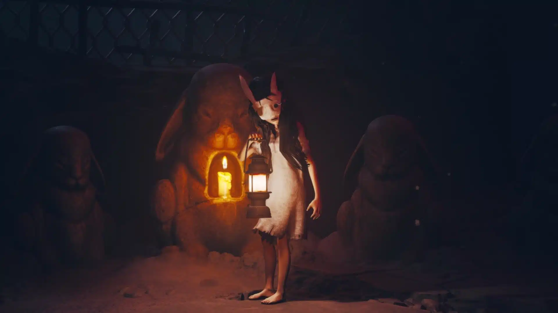 Masked child carries a lantern beside stone rabbit statues in Reanimal's dark cave