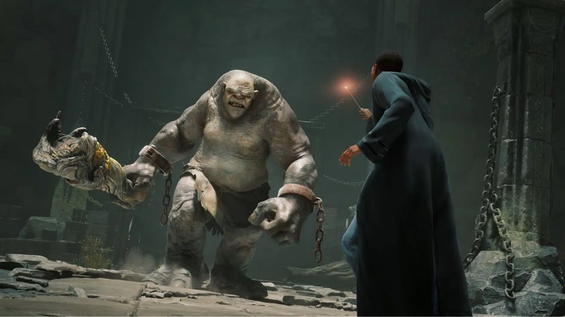 Hogwarts Legacy gameplay scene showing a wizard character facing a troll enemy