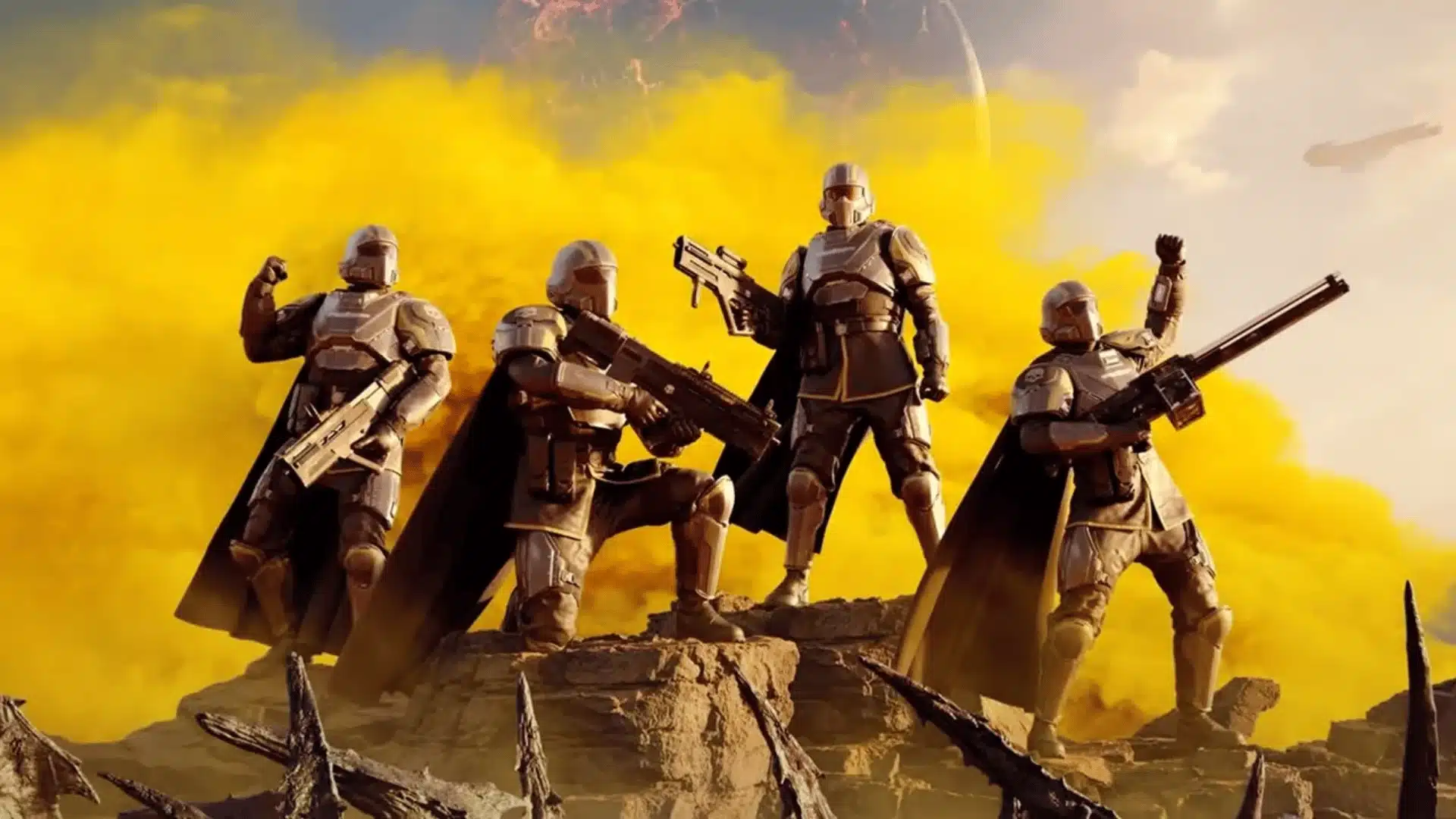Four Helldivers pose with weapons on a rocky ridge in front of a massive explosion of yellow smoke.