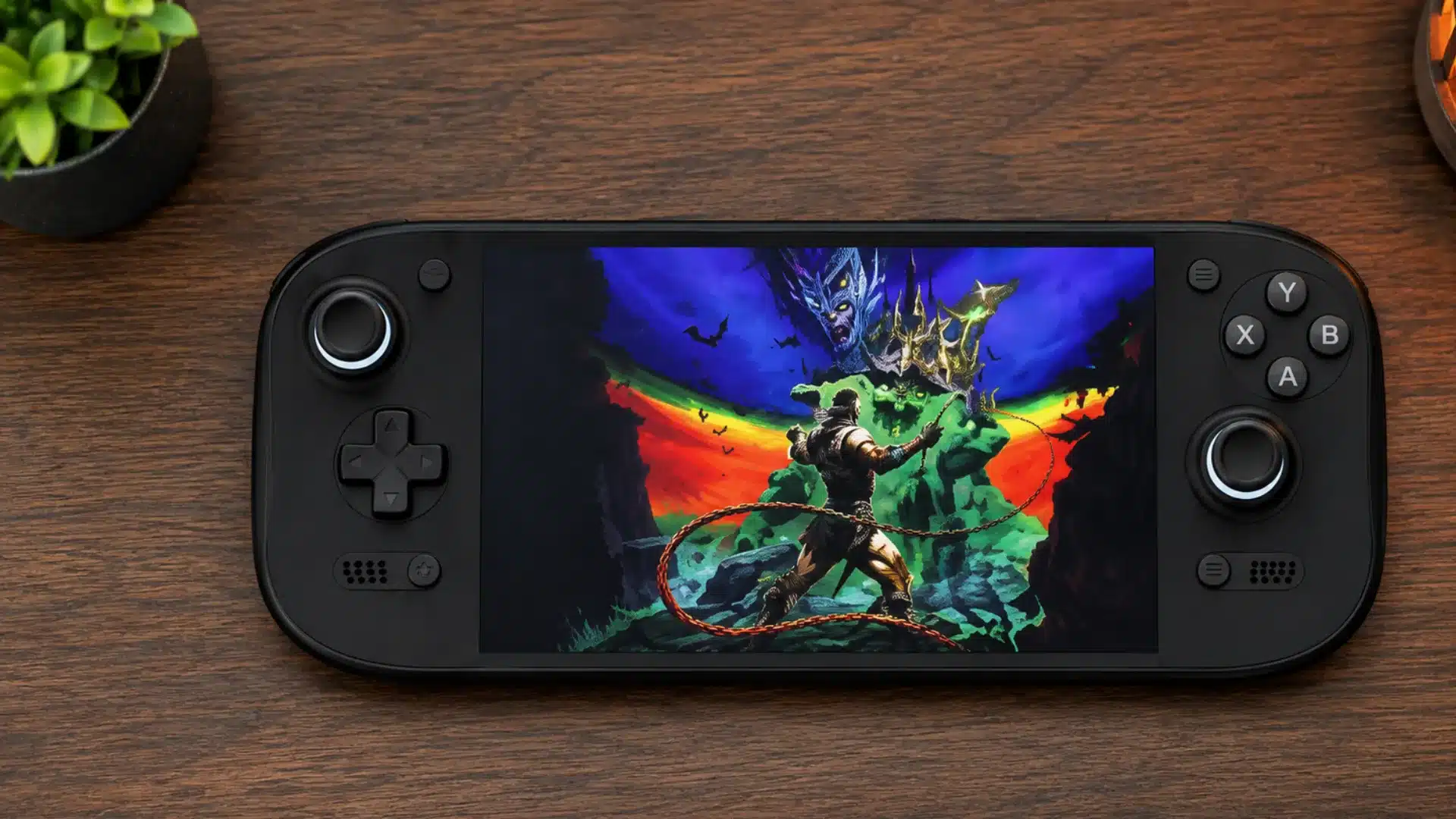 Black handheld console displays a fantasy action game on a warmly lit wooden desk