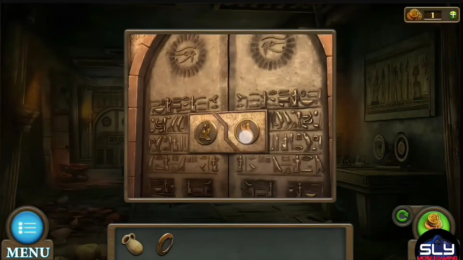 Stone doorway inside an ancient Egyptian tomb covered with hieroglyphic symbols.