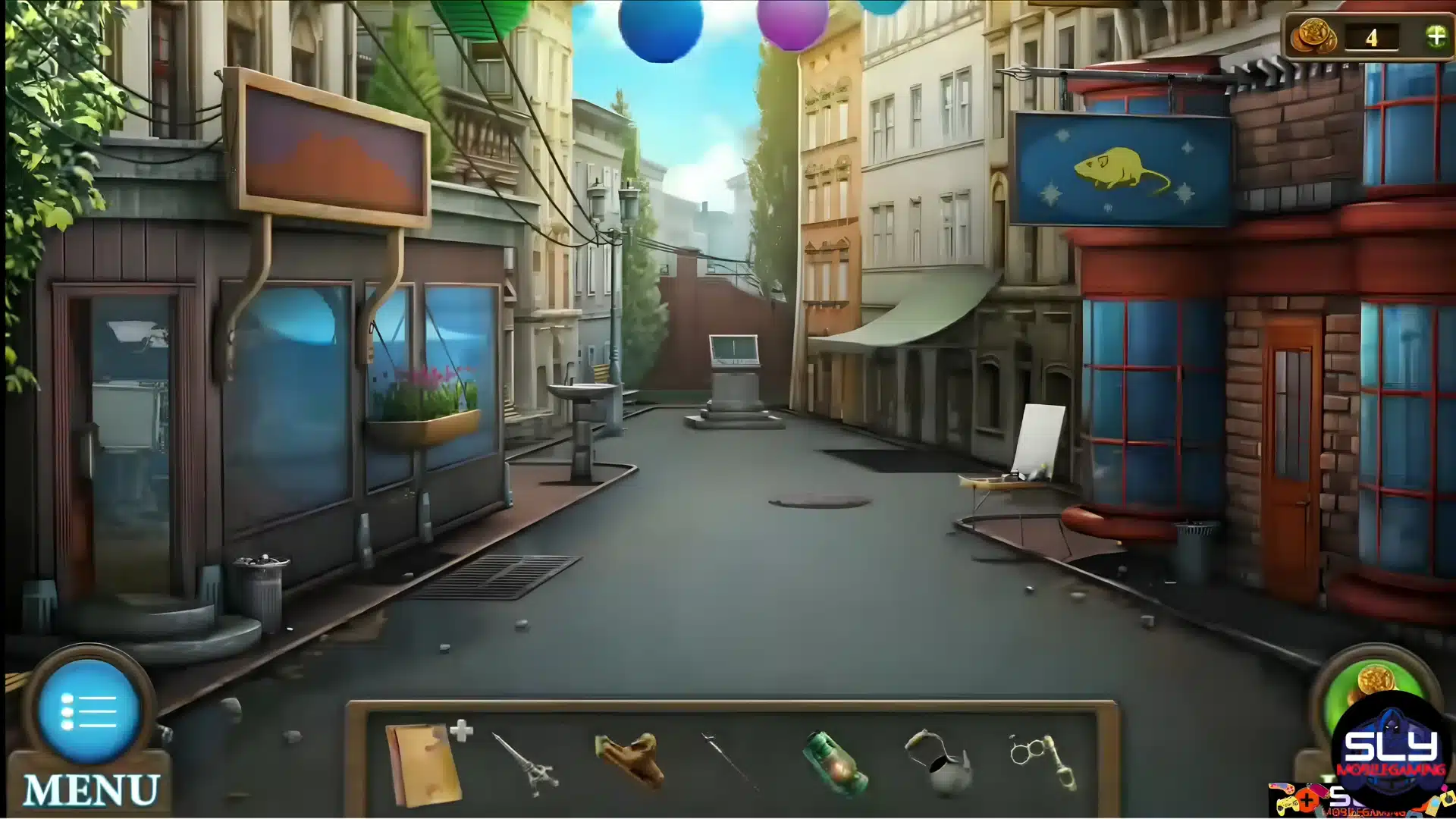 A quiet cobblestone street lined with European-style shopfronts and suspended colorful decorations.