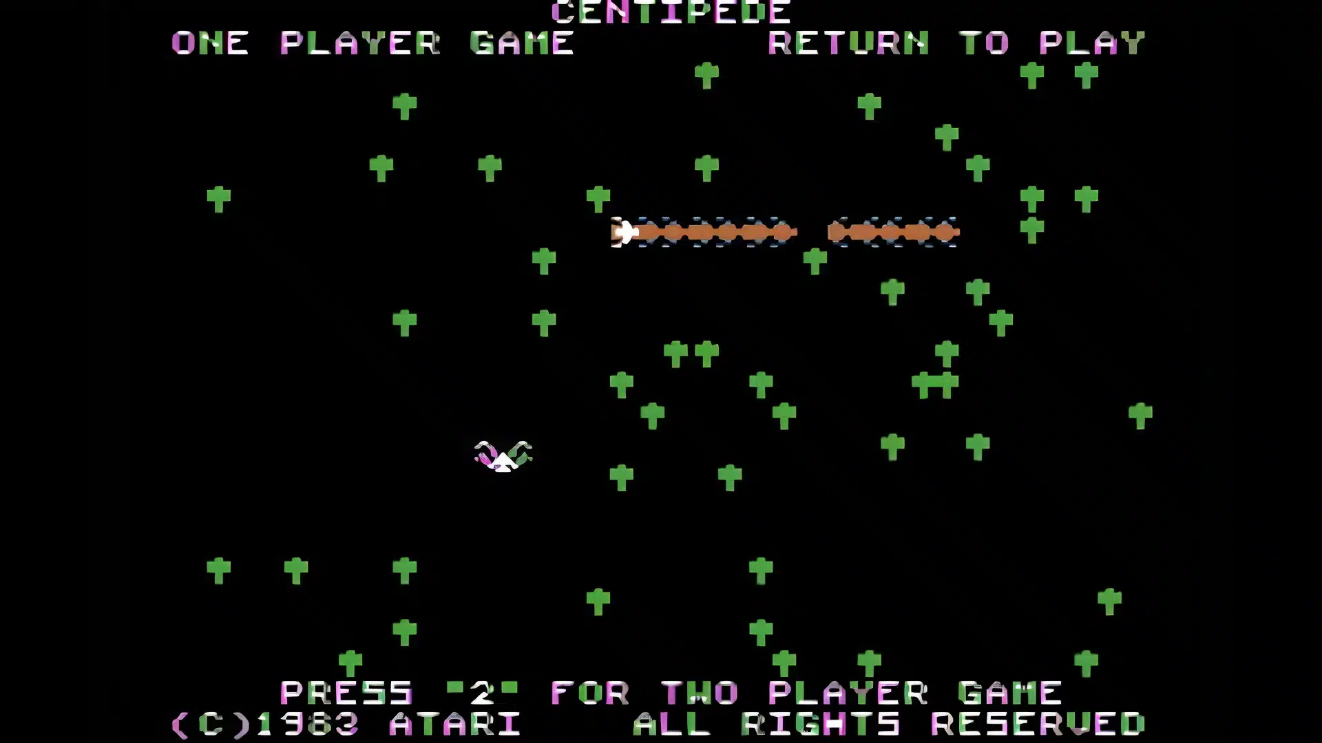 centipede arcade gameplay showing player shooting insects across a vertical playfield screen