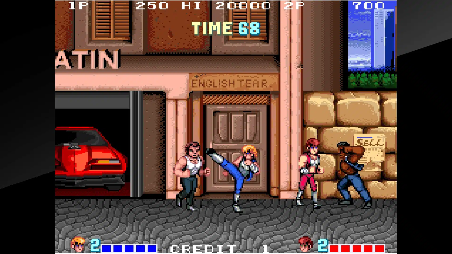 double dragon arcade gameplay showing two fighters battling enemies through an urban street scene