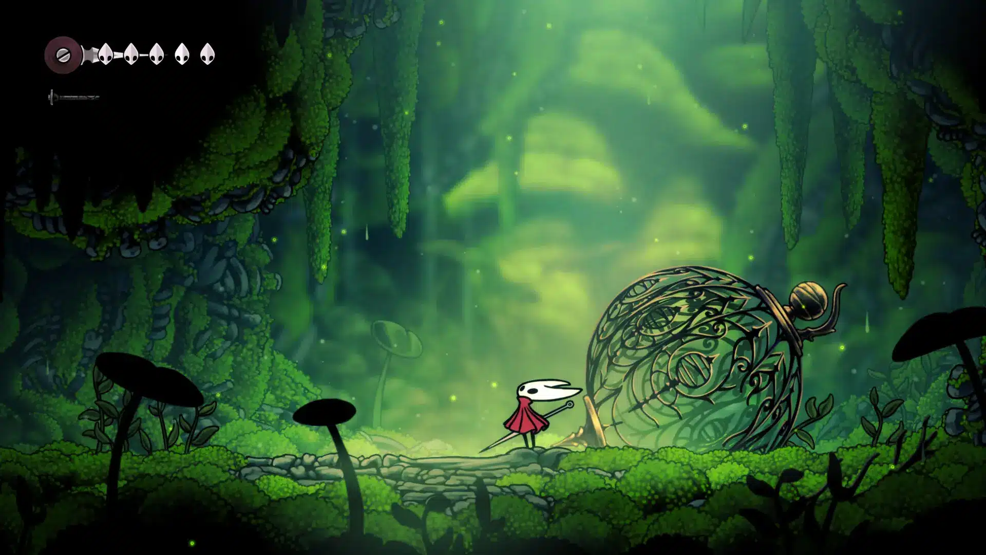 hollow knight gameplay scene showing small warrior exploring a green underground world with glowing areas