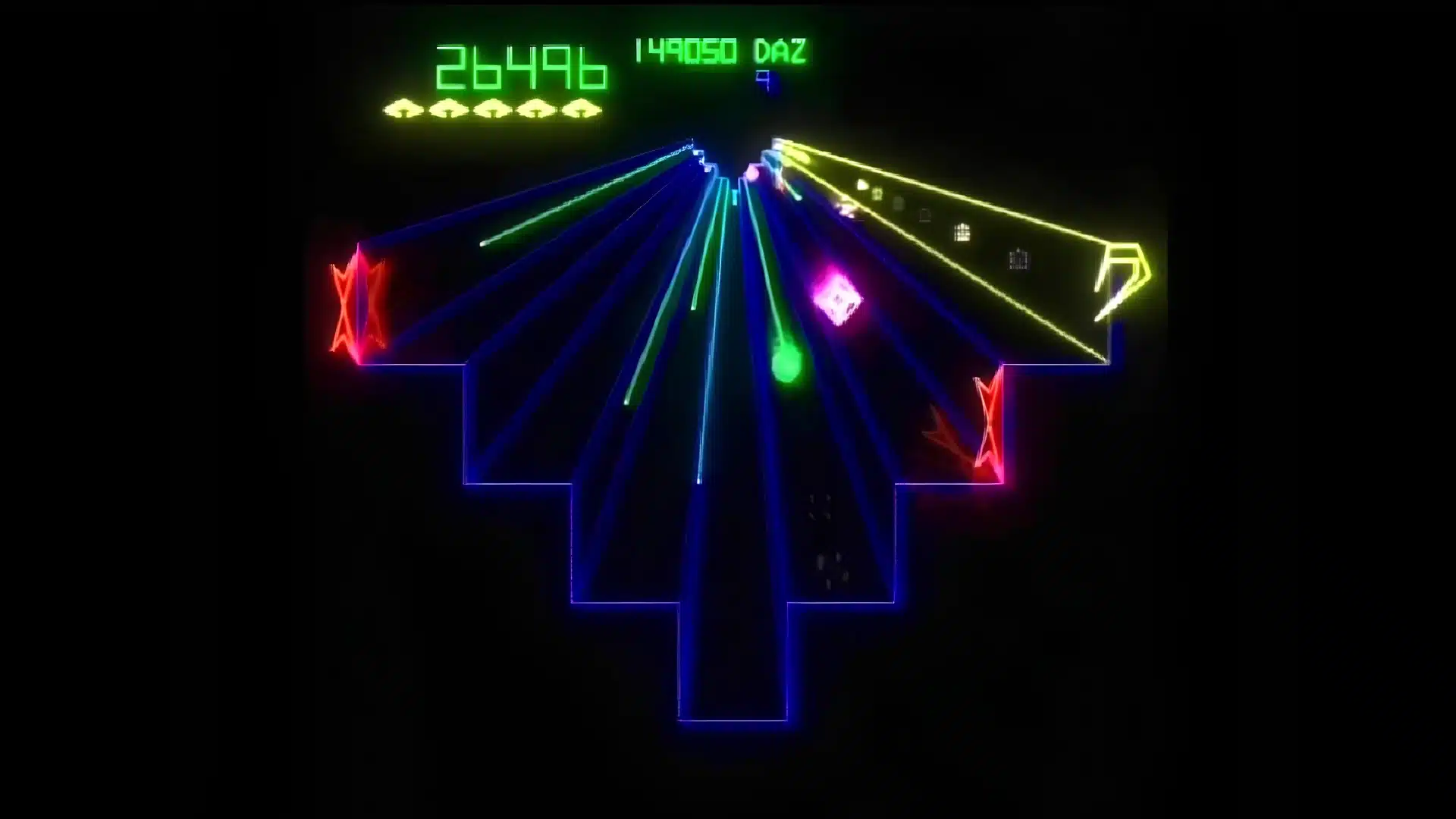 tempest arcade gameplay showing colorful vector graphics with enemies on geometric arcade paths